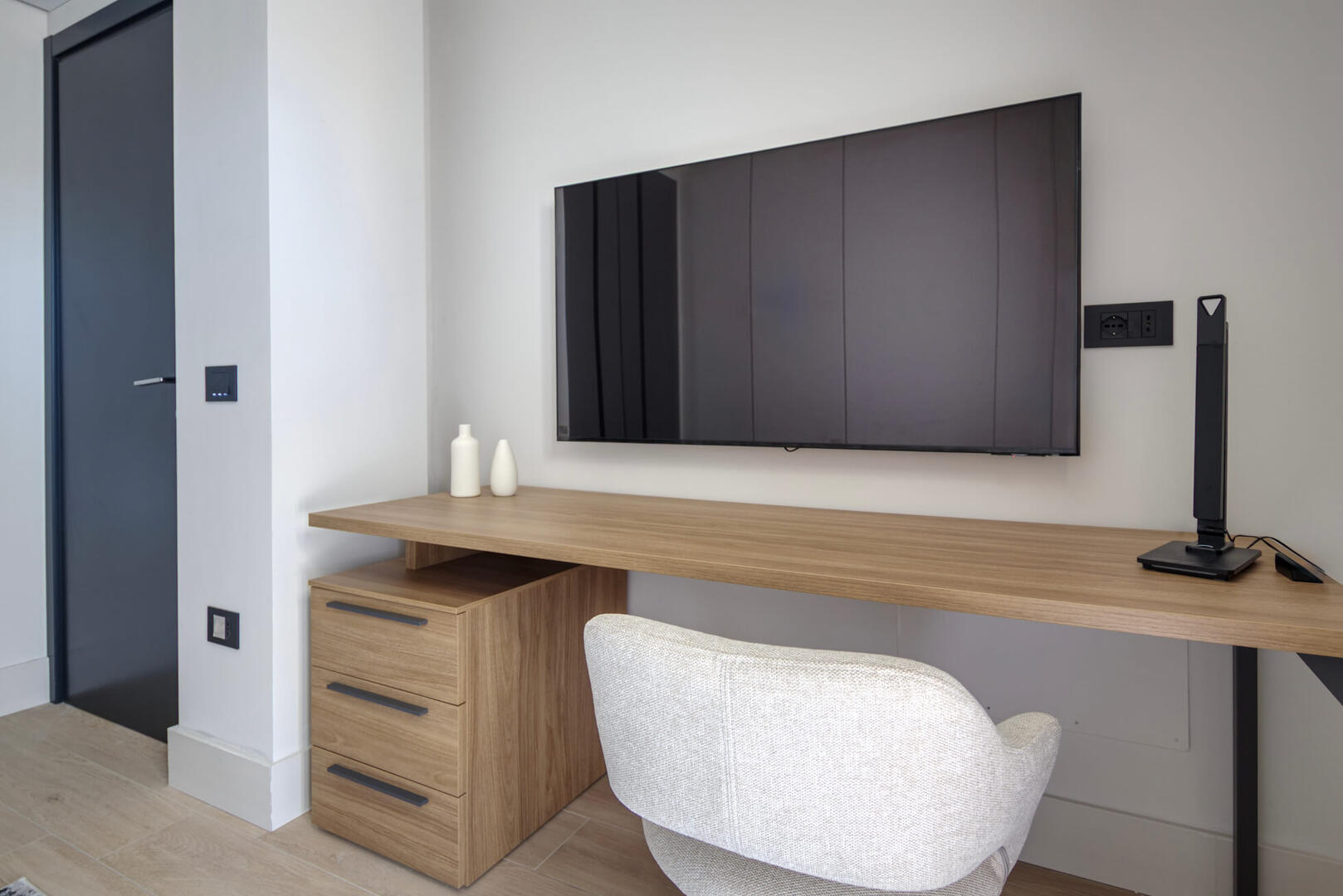 Even the second bedroom has a comfortable workspace/vanity and, of course, a big smart TV.