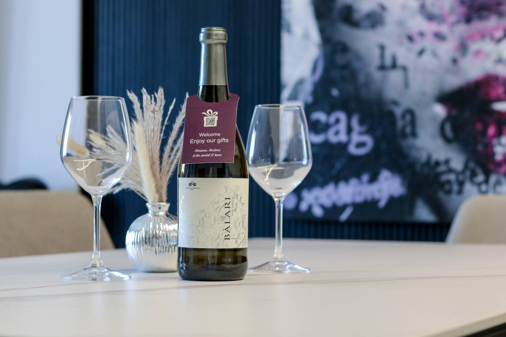 Complimentary welcome gift: local wine, water, cheese, and sausage.