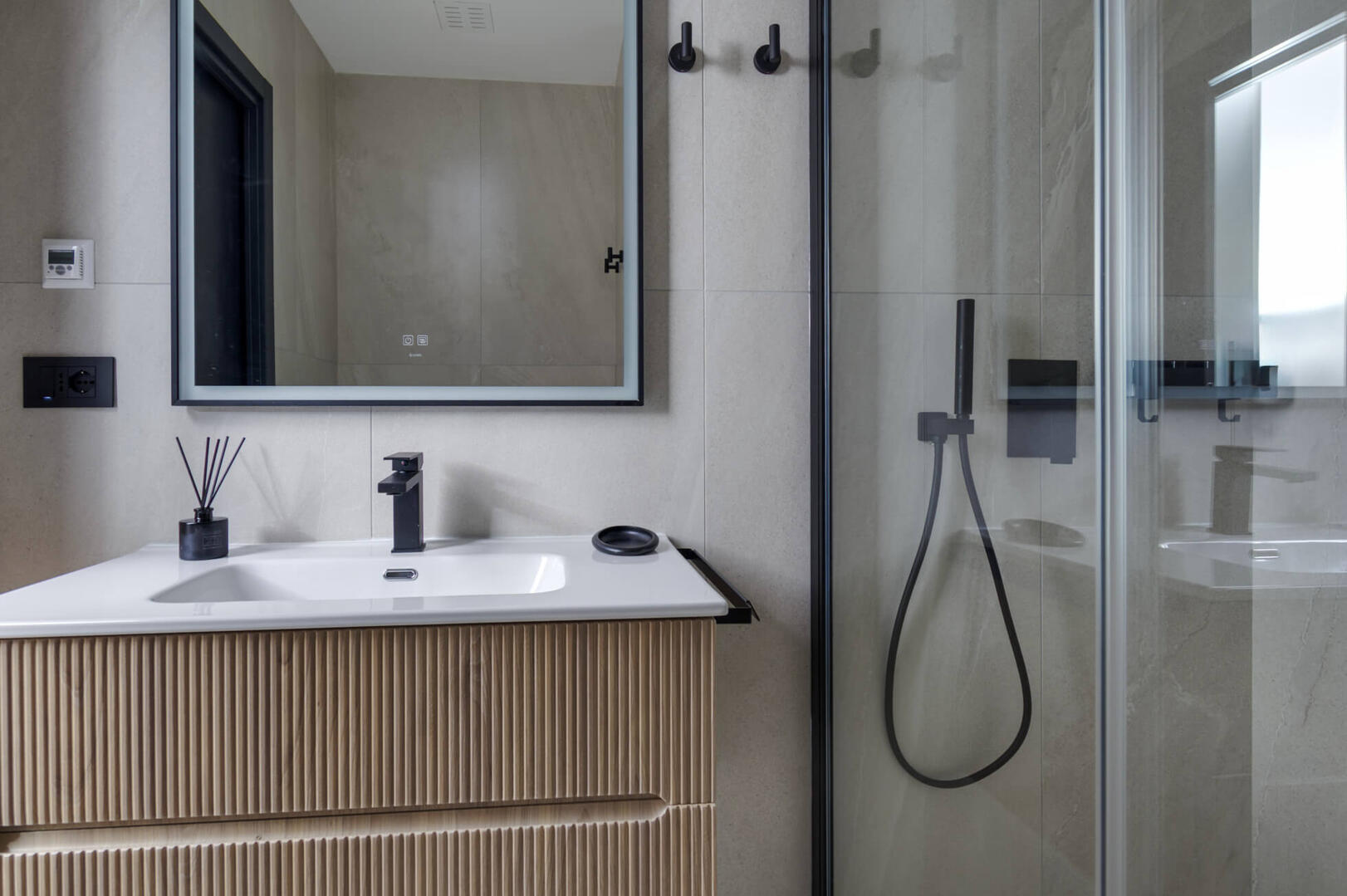 Walk-in shower with all amenities and high-end fixtures.